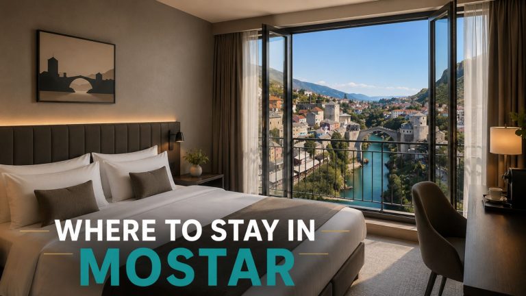 Modern hotel room in Mostar with panoramic city view through French balcony doors